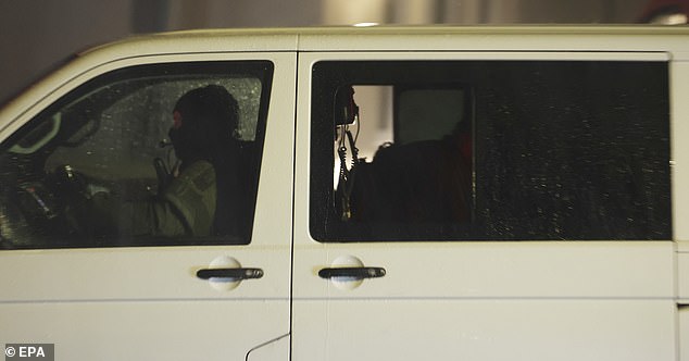 A police vehicle leaves after a search at a refugee centre in Solingen, Germany, on August 24