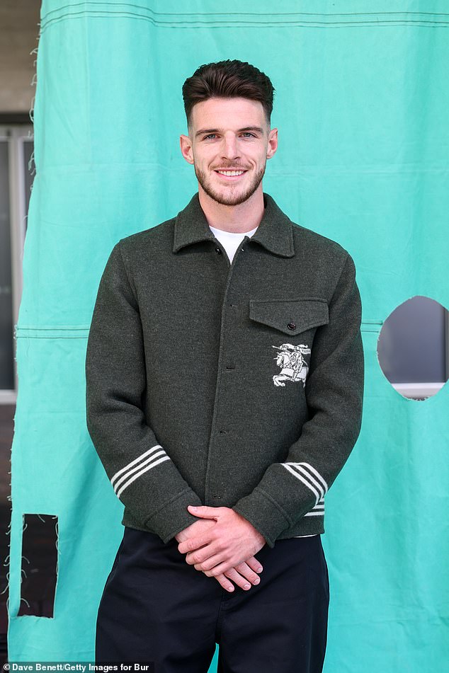 England and Arsenal midfielder Declan Rice swapped his football kit for a trendy green and white striped jacket