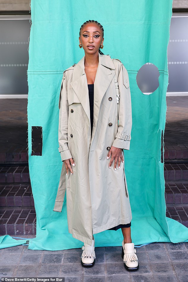 DJ Tarsza made an impact with her dramatic black eyeliner, while sporting a trench coat and fringed high-heeled loafers