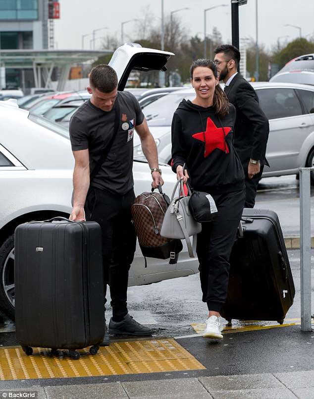 Loving life: Beaming broadly as she strolled towards the terminal, the 34-year-old TV personality seemed in great spirits on the outing