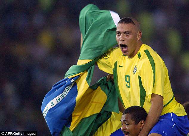 A 25-year-old Ronaldo, sporting a unique haircut, looked delighted as he paraded Brazil's flag