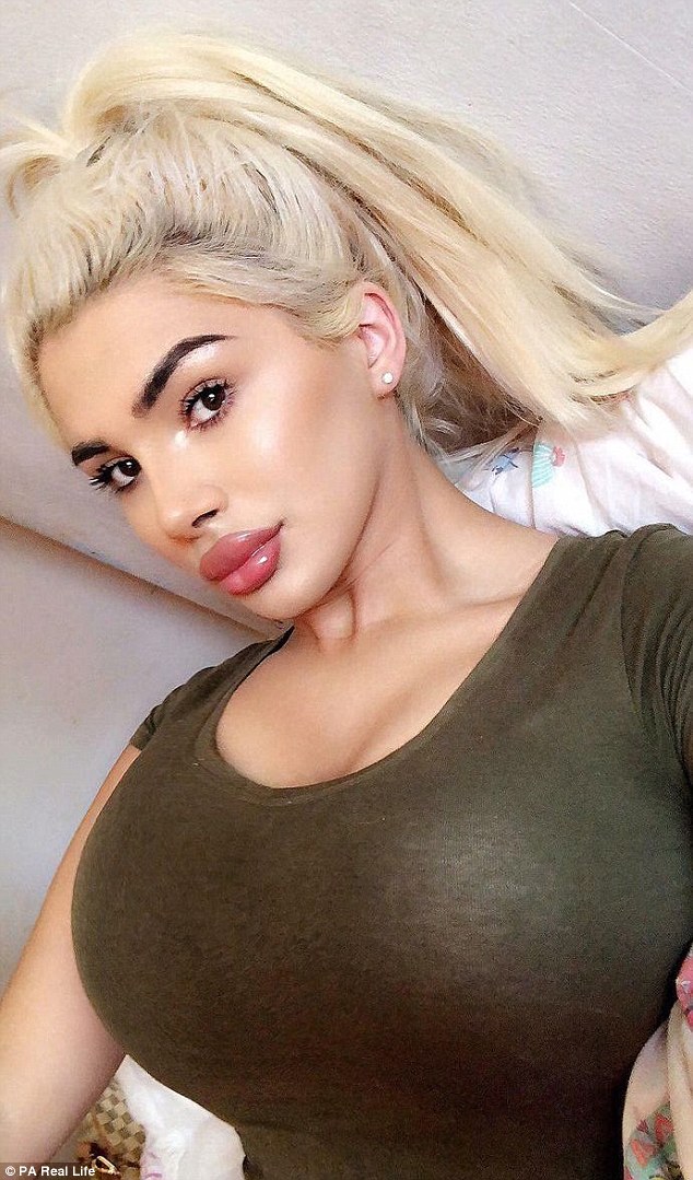 Transgender teen Kairah Kelly, pictured, has spent thousands on her dramatic makeover including lip fillers, hair extensions and makeup - but insists she hasn't had breast implants