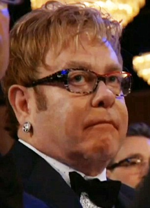 Not happy: Elton was pictured looking furious during Madonna's acceptance speech