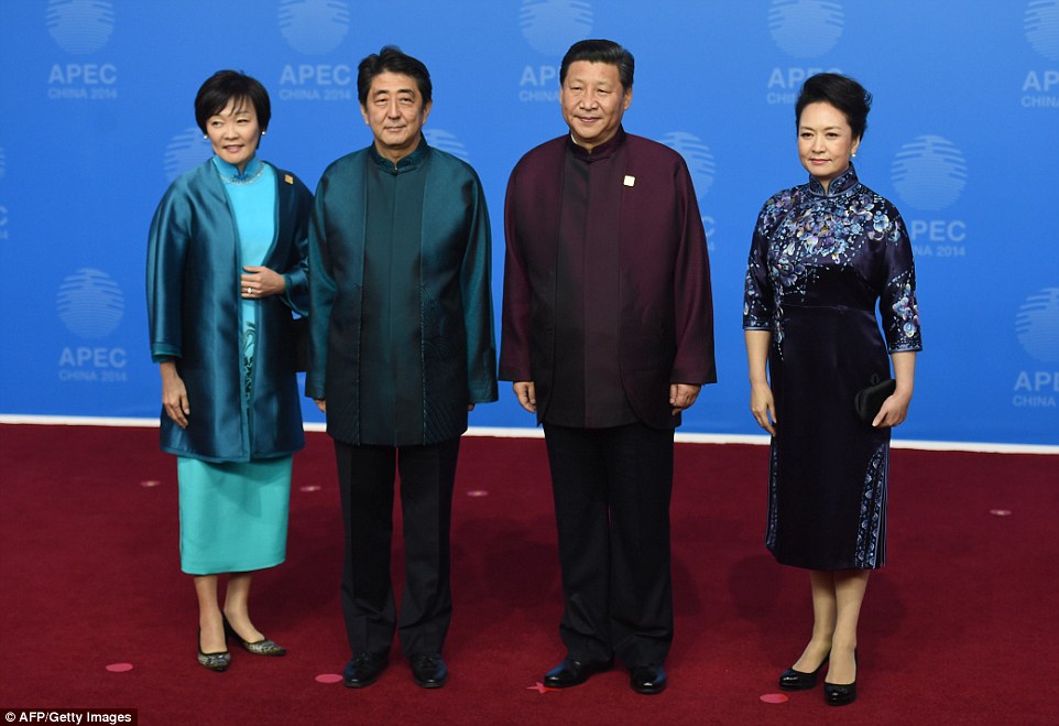 Japan's Prime Minister Shinzo Abe and his wife Akie (L) pose for a photo with Chinese President Xi Jinping and his wife Peng Liyuan at the Asia-Pacific Economic Cooperation (APEC) Summit  on November 10. Mr Abe is 5ft 10in and Mr Jinping is 5ft 9in