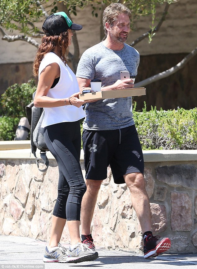 Toned: The pair were both kitted out in their workout clothes as they caught some rays on their way back to their car