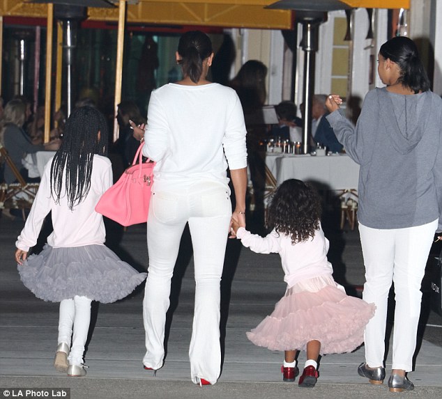 Family portrait: Mel and her three daughters donned colour coordinated outfits for their night out