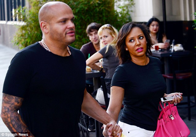 Tight: Mel B and husband Stephen stepped out together looking ready for business in Santa Monica