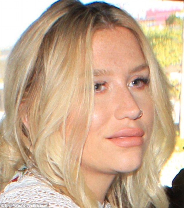 Fuller look: Singer Kesha's lips appeared to be much fuller as she arrived at LAX on Wednesday