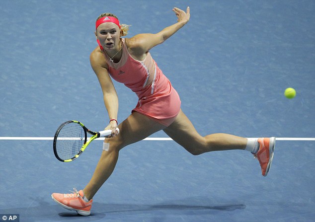 Athletic power: The tennis star, who is from Odense, Denmark, is ranked 19th in the world. She is pictured playing Dominika Cibulkova of Slovakia during the St. Petersburg Ladies Trophy tournament last Thursday 