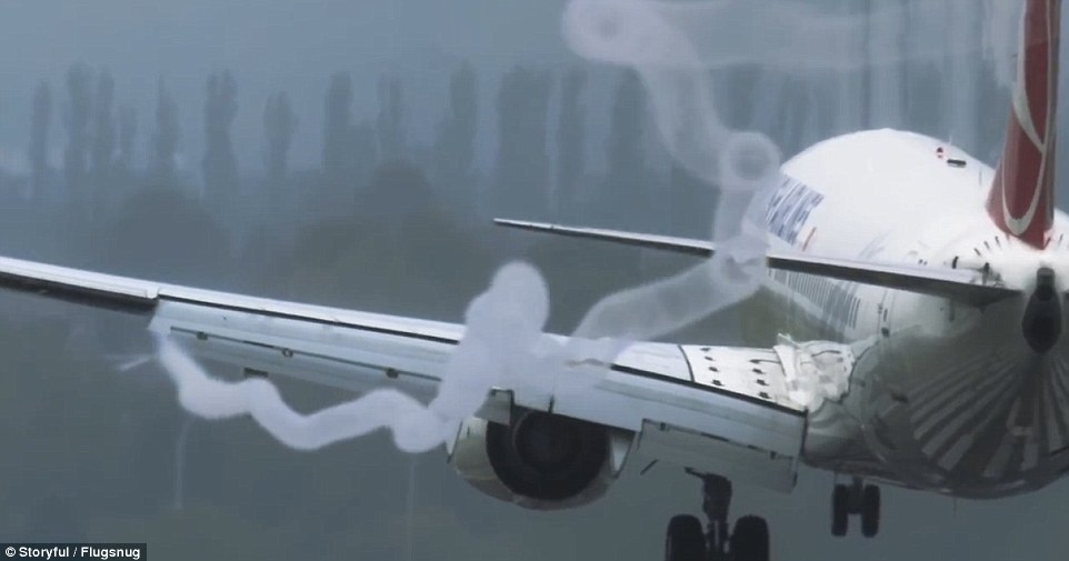 Compilation footage shot at Birmingham Airport shows what appears to be smoke (pictured above) coming off various planes