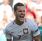 Poland's forward Arkadiusz Milik (C) celebrates his goal during the Euro 2016 group C football match between Poland and Northern Ireland at the Allianz Riviera stadium in Nice on June 12, 2016. 


/ AFP PHOTO / Valery HACHEVALERY HACHE/AFP/Getty Images