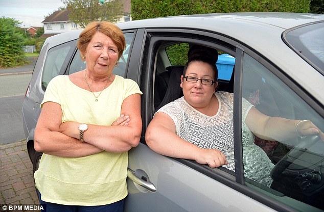 Kerry Parkes, 40, (right) was left stunned when she was charged a staggering £27 to park at Birmingham Airport for just 40 minutes, pictured with her aunt Marie McGee (left)