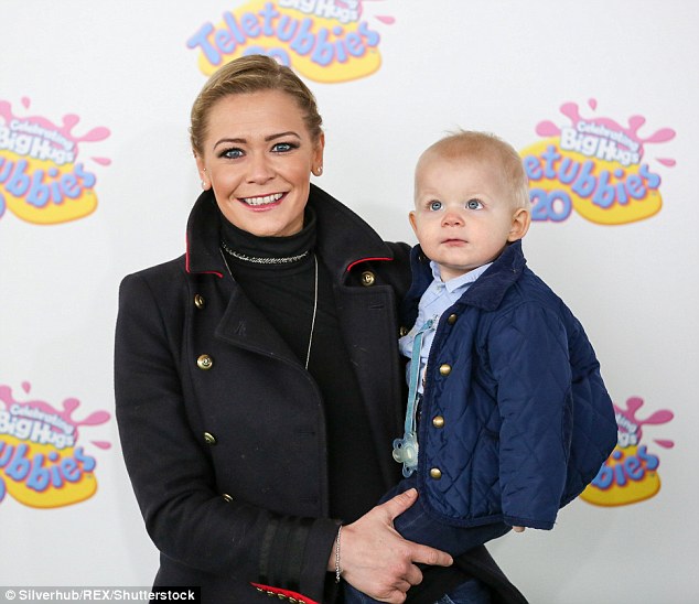 The eyes have it! She posed with her cute two-year-old son Rafferty, who looked fascinated