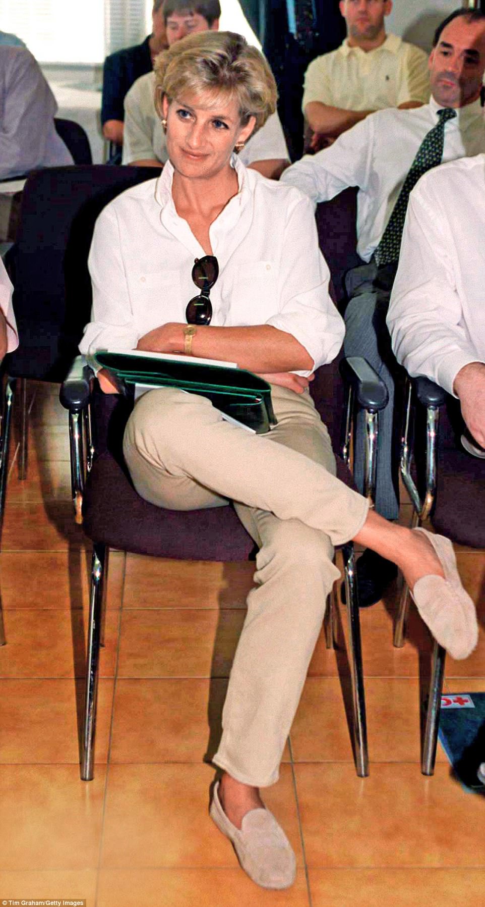 Sure-footed: Diana in her Tod’s beige suede loafers in Angola in 1997