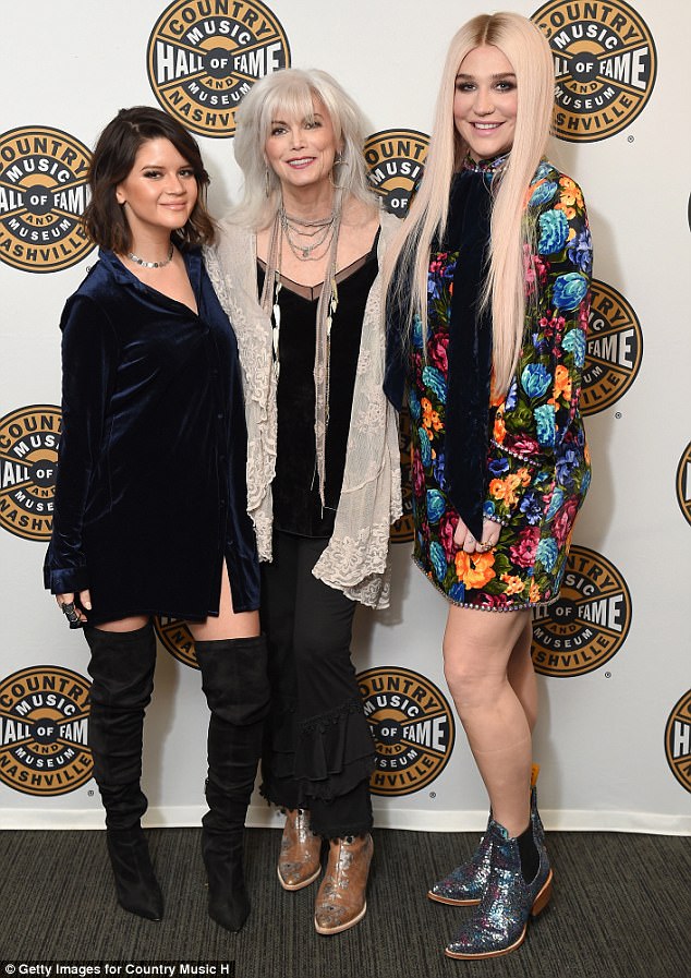 Three's company: Kesha attended the Country Music Hall Of Fame And Museum Reception in New York on Monday alongside fellow musicians Maren Morris (L) and Emmylou Harris (M)