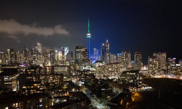 The CN Tower illuminated with green lights marking the 'National Day of Remembrance of the Quebec City Mosque Attack and Action Against Islamophobia.'