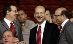 Manchester United board members Bryan Glazer, left, Avi Glazer, center, and Joel Glazer are pioneering a kind of non-exiting exit that gives them all the spoils of ownership with none of the accountability.