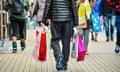 A man carrying bags in the Broadmead shopping area of Bristol