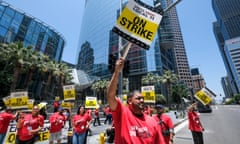 US-LABOR-HOTEL-STRIKE<br>Striking hotel workers walk the picket line outside the Intercontinental Hotel in Los Angeles, California, on July 2, 2023. Thousands of hotel workers in Southern California walked off the job on Sunday, in an effort to secure higher pay and improvements in health care and retirement benefits. (Photo by RINGO CHIU / AFP) (Photo by RINGO CHIU/AFP via Getty Images)