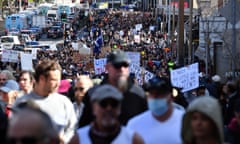 Protesters march along Broadway and George St towards Sydney Town Hall during the World Wide Rally For Freedom anti-lockdown rally at Hyde Park in Sydney