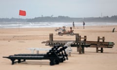 Empty sunbathing chairs are seen on a beach near hotels in a tourist area in Bentota, Sri Lanka