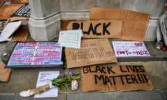 Signs and placards at the base of the Edward Colston statue plinth in Bristol city centre