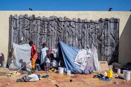 People displaced by gang war violence in Cite Soleil take refuge in the Plaza Hugo Chávez, an open-air public park in Port-au-Prince, Haiti 16 October.