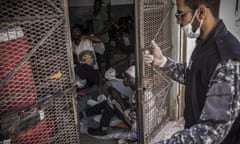 A guard closes the door of a cell in Abu Salim detention centre, in the Libyan capital Tripoli.