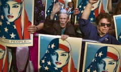 In this Feb. 19, 2017, file photo, people carry posters during a rally against President Donald Trump’s executive order banning travel from seven Muslim-majority nations, in New York’s Times Square. Trump’s travel ban has been frozen by the courts, but the White House has promised a new executive order that officials say will address concerns raised by judges that have put the policy on hold. The first order was met by legal challenges, confusion at airports worldwide and mass protests, but the White House has forecast smoother sailing the second time around. (AP Photo/Andres Kudacki)