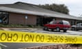 crime scene tape in front of a bank