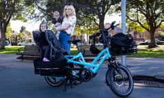 Guardian Australia picture editor Carly Earl trials an ebike for her daily commute in Sydney to a CBD office via her children’s daycare