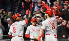 Bryce Harper and shortstop Jean Segura  gesture after Harper’s two-run home run during the eighth inning