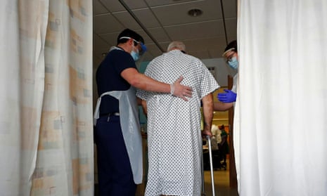 Occupational therapists treat a patient during lockdown, at the Royal Blackburn teaching hospital.