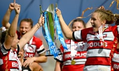 Natasha Hunt and Zoe Aldcroft lift the trophy after their victory over Bristol