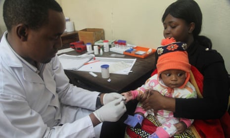 A doctor tests a child for malaria in Arusha, Tanzania.