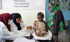 Qureisha Juma, 17, brings her niece Suheyba Faisal for a screening at Iftin hospital in Garissa, which is seeing a rise in patients from other areas.