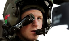 Prince Harry wears a monocle gun sight as he sits in the front seat of his Apache helicopter.