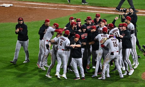 The Arizona Diamondbacks celebrate after beating the Phillies in Game 7 to claim the National League pennant.