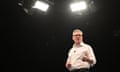 Keir Starmer speaks on a stage under lights