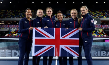 The British 2019 Fed Cup women’s team pose together holding the Union Jack