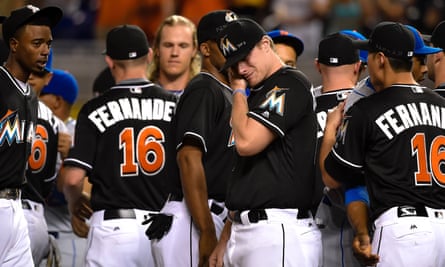 Miami Marlins starting pitcher Tom Koehler wipes tears away after greeting all the New York Mets players at the pitchers mound in honer of Marlins starting pitcher José Fernández who passed away from a boating accident in September.