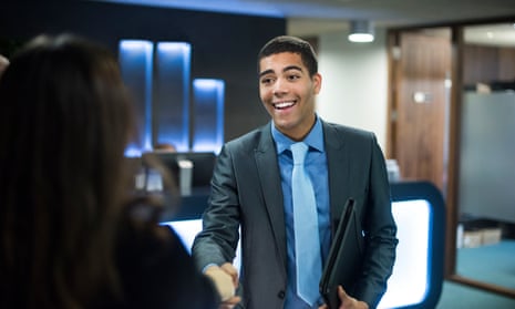 Posed by model young man at his job interview with his cv under his arm