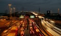 A night time, time-delayed sequence picture of traffic flow at the Dartford crossings on the Kent side of the Thames.