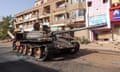 A damaged army tank on a street in Omdurman in April.