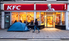 A homeless person's tent pitched outside KFC on the main shopping street on Western Road, in Brighton