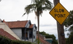 house with sign that says 'slow point' in front of it