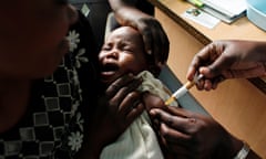 A baby receives the RTS,S vaccine part of a trial in Kombewa, western Kenya. 