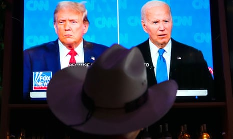 Man wearing a cowboy hat watches the presidential debate between  Joe Biden and Donald Trump.