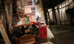 Six-year-old Nirmeen, from Aleppo, takes a break from selling roses on the Beirut seafront