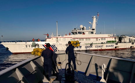 Philippine Coast Guard personnel prepare rubber fenders after Chinese Coast Guard vessels blocked their way to a resupply mission at the Second Thomas Shoal in the South China Sea in March 2024.